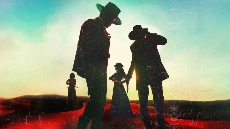 Silhouetted figures in wide-brimmed hats and period dress standing on red-tinted desert dunes at sunset, dramatic western mood